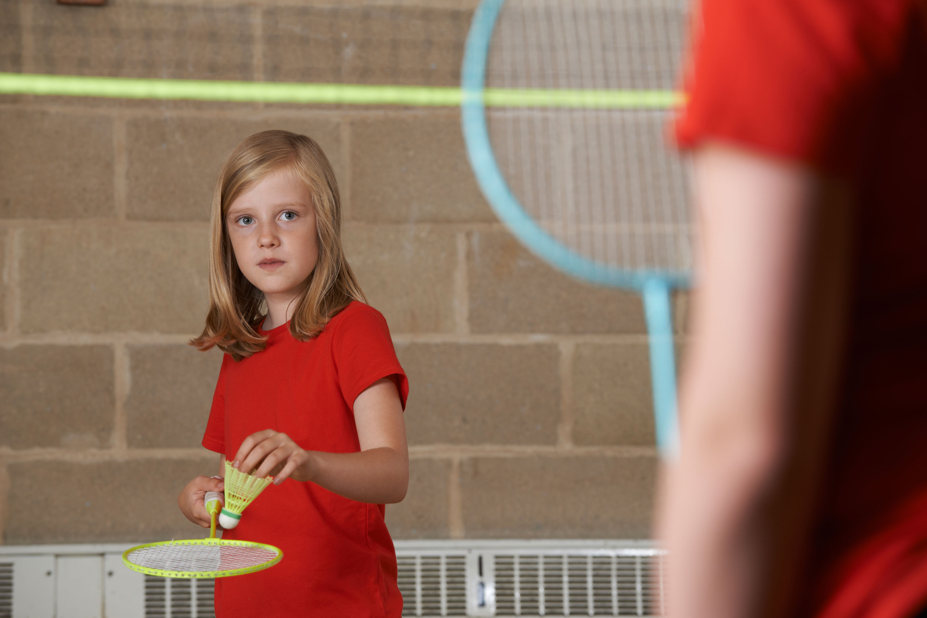 A girl playing badminton