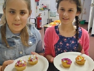 Two girls with plates of cake